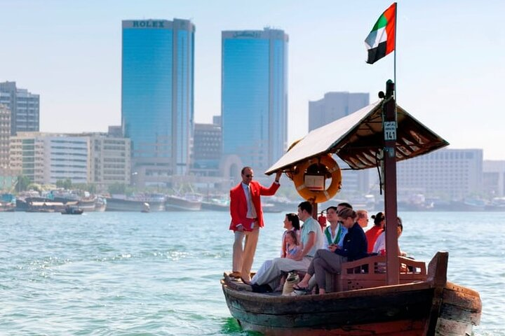 Experience the charm of Old Dubai aboard an abra exploring cultural heritage traditional markets and the iconic Gold Market all while soaking in the rich history of the area.